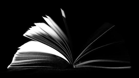 black and white image of book open on it's spine