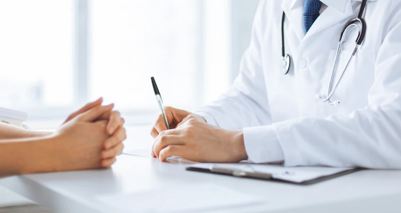 Patient holding hands with visitor