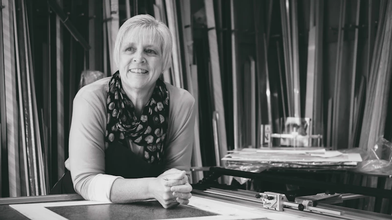Marilyn Jenkins stands in her shop, Davies Framing Services