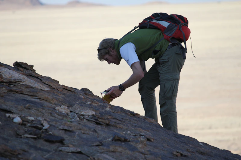Scientist gathering rock samples in Namibia