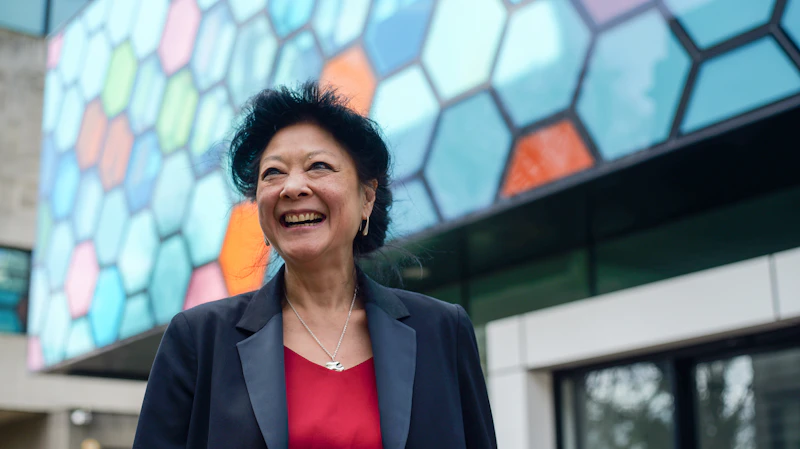 A woman outside the School of Biosciences