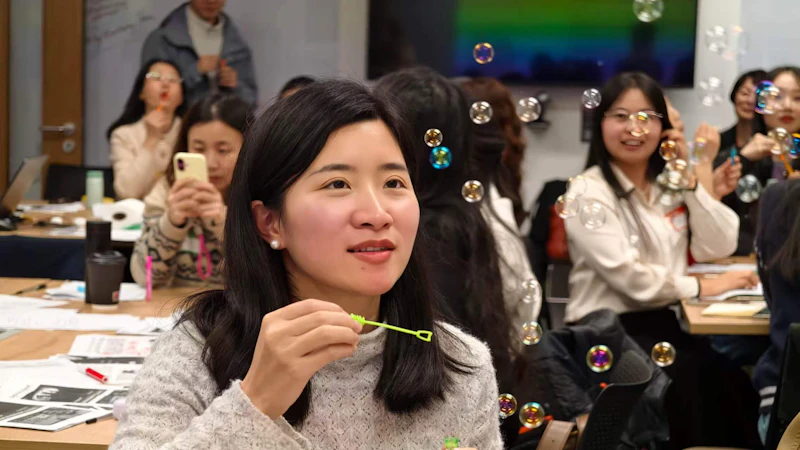Teacher blowing bubbles
