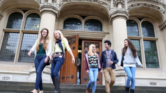 Undergraduate students outside Queen's Buildings