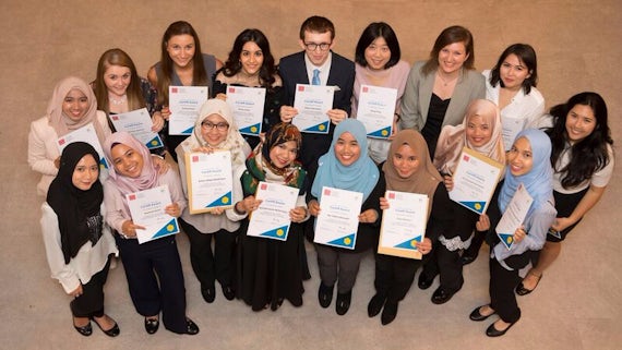 Mixed group of Business School students celebrate their Cardiff Award success