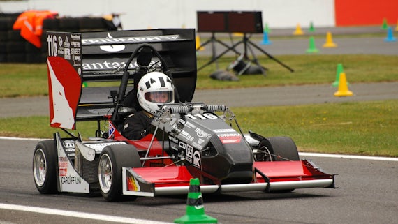 Student driving Formula Student car in race.